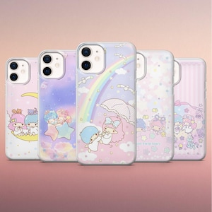 May include: Five phone cases with colourful designs featuring cartoon characters, rainbows, and stars. The cases are in shades of pink, purple, and blue, with a clear protective layer. The overall theme is whimsical and cute.