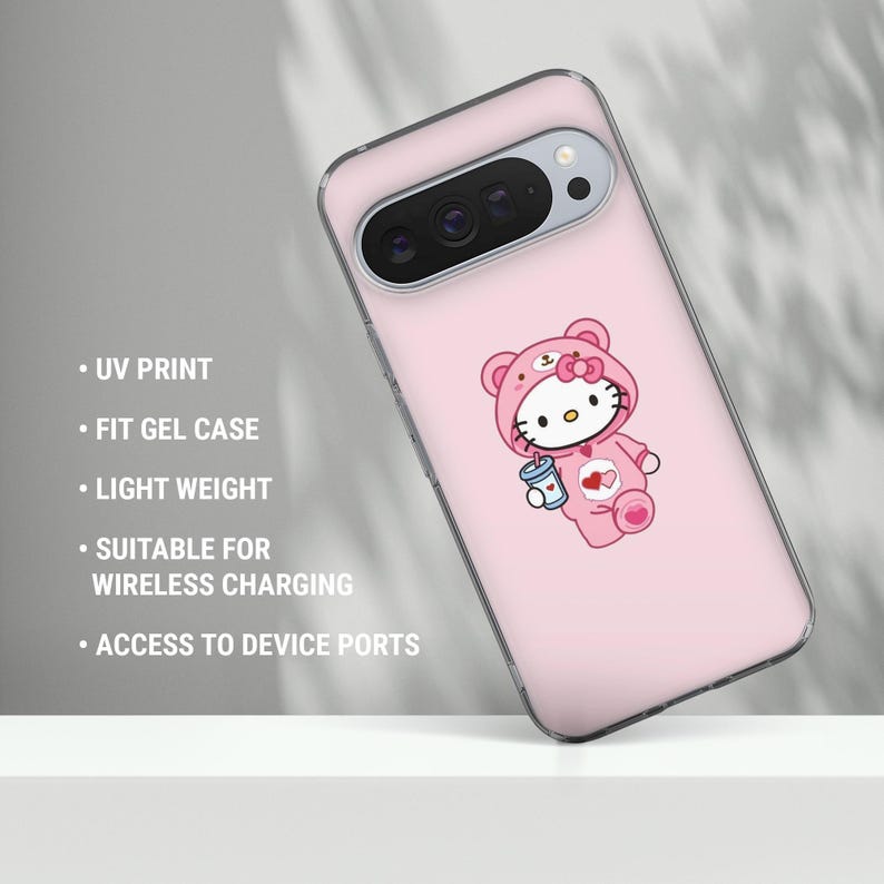 May include: A pink phone case featuring a cartoon character in a bear costume holding a drink. The case has a clear border and text that reads "UV PRINT", "FIT GEL CASE", "LIGHT WEIGHT", "SUITABLE FOR WIRELESS CHARGING", and "ACCESS TO DEVICE PORTS."