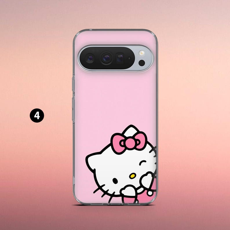 May include: A pink phone case featuring a Hello Kitty graphic. The case has a clear border and a pink background. The Hello Kitty design includes a pink bow and is winking. The phone case has a camera cutout at the top.