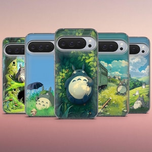 May include: Five phone cases with illustrations of the animated character Totoro. The cases show scenes with Totoro in a forest, under an umbrella, and near a train. The cases have a clear, protective design.