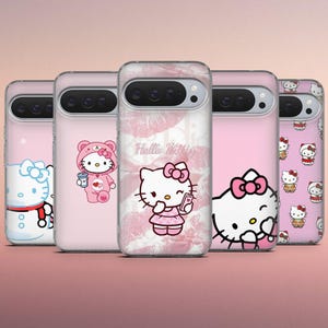May include: A collection of pink phone cases featuring Hello Kitty designs. The cases showcase various images of the character, including one with a bow, one in a winter outfit, and another holding a phone. The cases have a clear, glossy finish.