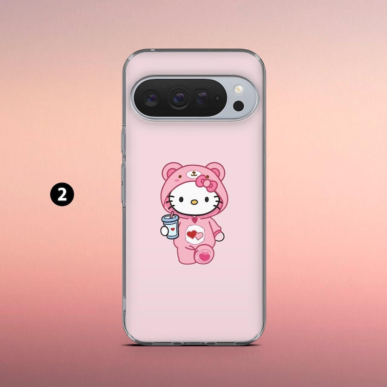 May include: A clear phone case featuring a pink cartoon character in a pink bear costume holding a blue cup. The character has a white face, black eyes, and a pink bow. The phone case has a camera and flash.