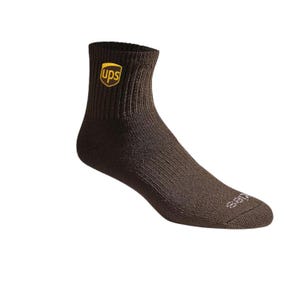 May include: A brown ankle sock with the UPS logo in yellow. The sock is made of a ribbed knit material. The word "Dickies" is printed on the toe.