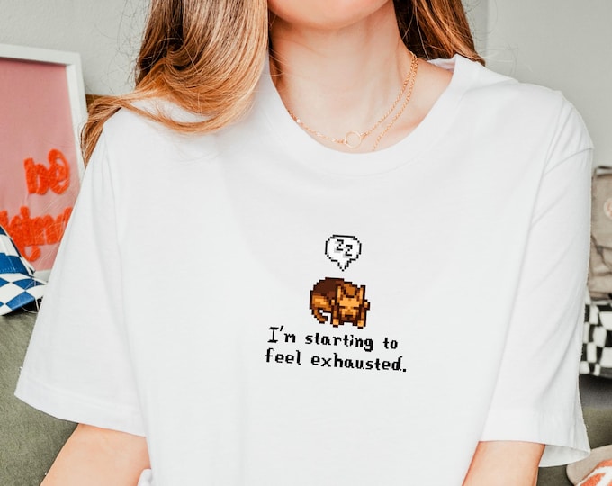 Featured listing image: Stardew Valley Sleepy German Shepherd Tee, Cozy Gamer Gift, Exhausted Quote T-Shirt, Stardew Fan Shirt, Unisex Gaming Top, Dog Lover Tee
