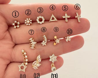 Örhänge i guld med stjärna och kors: Piercing i kirurgiskt stål, 0,8 mm stift