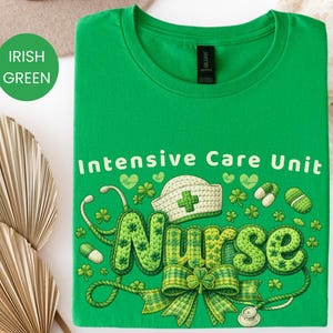 May include: Irish green t-shirt with the words "Intensive Care Unit Nurse" in white and green. The design includes a nurse's cap, stethoscope, shamrocks, and pills. The shirt is folded and displayed on a white surface.