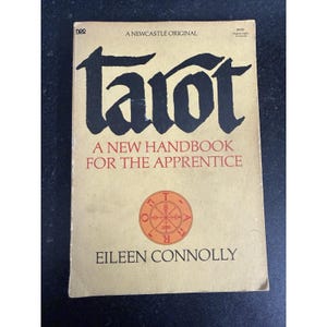 May include: A vintage book titled "Tarot: A New Handbook for the Apprentice" by Eileen Connolly. The cover is beige with black and red text and a circular illustration. The book is a "Newcastle Original".