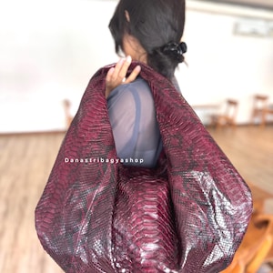 May include: A white ceramic mug with a black handle and the text "But First, Coffee" in a handwritten style. The mug is on a white surface. The mug is 4 inches tall.