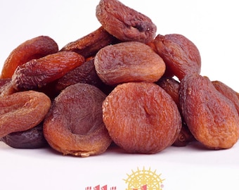 May include: A collection of dried apricots in shades of reddish-brown. The fruits display a wrinkled texture and diverse shapes, some whole and others halved. The logo "güllüoğlu 1871" is present at the bottom.
