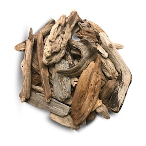 May include: A pile of weathered driftwood pieces in various shapes and sizes. The wood tones range from light tan to dark brown, with visible textures and natural holes. Ideal for crafting or home decor.