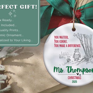 May include: A white ceramic Christmas ornament with a Winnie the Pooh illustration and the text "YOU MATTER. YOU COUNT. YOU MAKE A DIFFERENCE." The ornament is personalized with "Ms. Thompson" and "CHRISTMAS 2025."