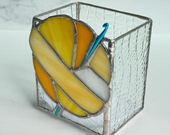 Yellow and orange crochet tool storage container created with ombré shades of yellow orange and white stained glass.