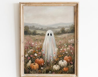May include: A framed art print titled VINTAGE GLOW PRINTS featuring an oil painting of a white ghost standing in a field of wildflowers and orange pumpkins under a cloudy sky. The scene depicts a landscape with rolling hills in the background.