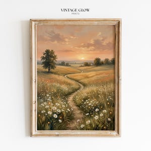 Könnte beinhalten: Gerahmter Kunstdruck mit einem Sonnenuntergang über einem Feld mit Wildblumen und einem gewundenen Pfad. Das Kunstwerk hat eine warme Farbpalette mit goldenem Himmel und einem rustikalen Holzrahmen. Der Text "VINTAGE GLOW PRINTS" steht oben.