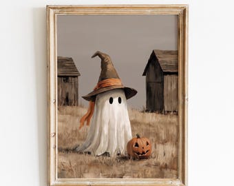 Puede incluir: Una impresión artística enmarcada titulada VINTAGE GLOW PRINTS que muestra un fantasma blanco con un sombrero de bruja marrón y una cinta naranja, de pie en un campo con dos estructuras de madera y una calabaza naranja tallada.