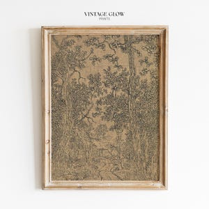 May include: A framed print showcasing a detailed black and white forest scene. The artwork depicts tall trees, foliage, and a small structure in the distance. The print is set in a light-coloured wooden frame. The text "VINTAGE GLOW PRINTS" is at the top.