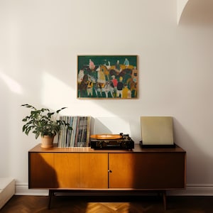 May include: A mid-century modern wooden cabinet with a record player, vinyl records, and a framed painting. The painting depicts figures on horseback. A potted plant sits on the cabinet. The cabinet has a warm wood tone.