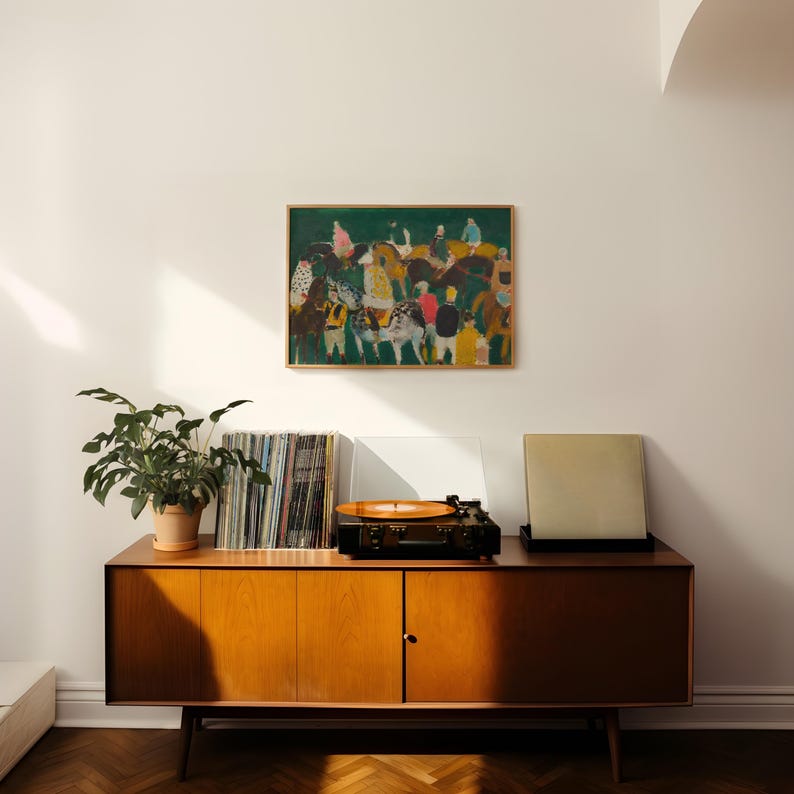 May include: A mid-century modern wooden cabinet with a record player, vinyl records, and a framed painting. The painting depicts figures on horseback. A potted plant sits on the cabinet. The cabinet has a warm wood tone.