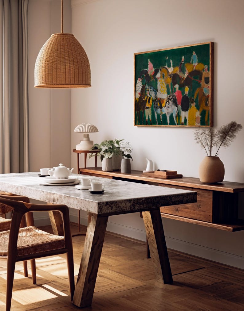 May include: A dining room scene featuring a marble-topped table with wooden legs and chairs. A woven pendant light hangs above. A painting with figures on horses hangs on the wall. A wooden sideboard and decorative items complete the scene.
