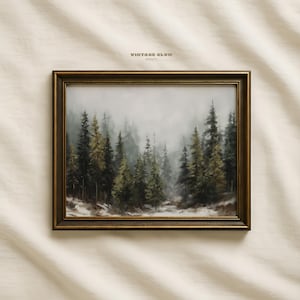 May include: A framed print of a forest scene shrouded in mist. The artwork shows tall evergreen trees in shades of green and brown, with a hint of snow at the base. The frame is a dark gold colour, and the text "VINTAGE GLOW PRINTS" is visible.