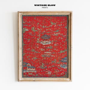 May include: Framed print featuring a vibrant red background with a detailed, traditional Asian-inspired design. The artwork includes pagodas, figures, and trees in shades of green, blue, and gold. The frame is a light, neutral color, enhancing the artwork's rich colors.
