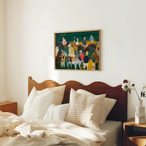 May include: A framed abstract painting with a green background and figures in various colors hangs above a bed. The bed has a wooden headboard, striped pillows, and a beige and white striped comforter. A small wooden nightstand is next to the bed.