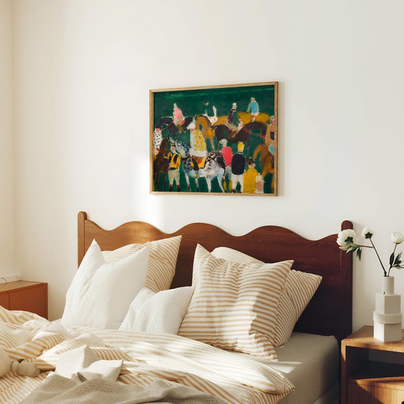 May include: A framed abstract painting with a green background and figures in various colors hangs above a bed. The bed has a wooden headboard, striped pillows, and a beige and white striped comforter. A small wooden nightstand is next to the bed.