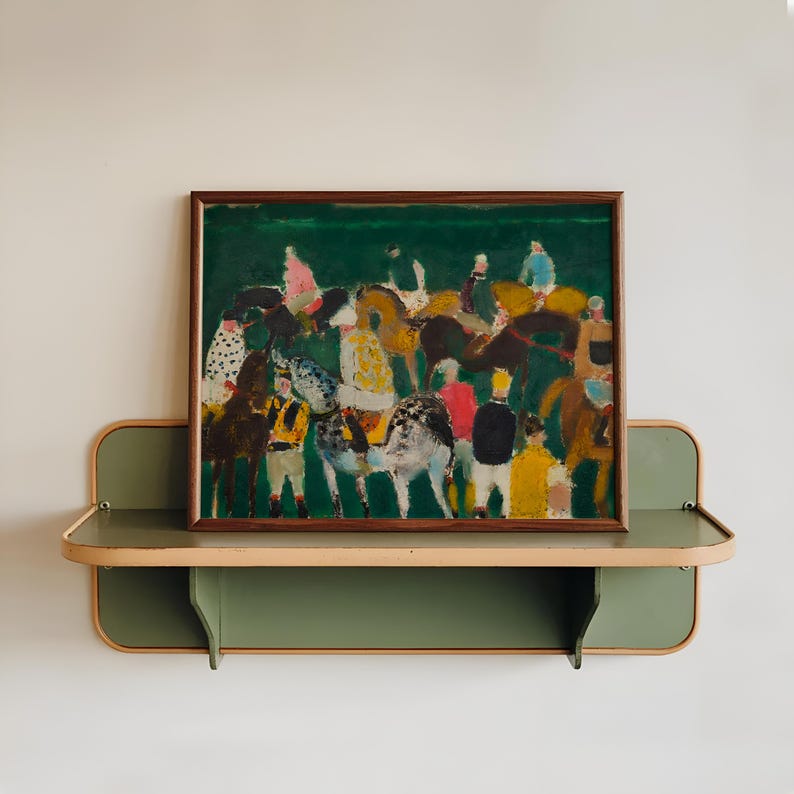 May include: An abstract painting of a horse race, framed in dark wood, hangs above a green and tan shelf. The artwork features riders and horses in various colors against a green background. The shelf has a curved design.