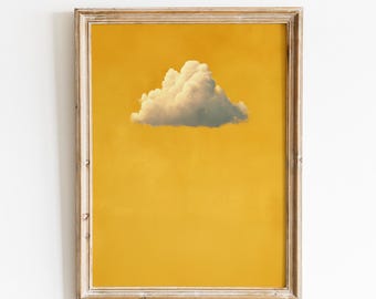 May include: A framed art print featuring a fluffy white cloud against a vibrant yellow background. The print is in a distressed wooden frame. The text "VINTAGE GLOW PRINTS" is at the top.