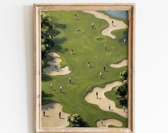 May include: A framed art print titled VINTAGE GLOW PRINTS featuring an aerial view of a golf course with green fairways, sand bunkers, and small figures of golfers in various colored shirts scattered across the landscape in a painterly style.