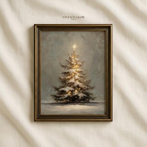 May include: A framed wall art print titled VINTAGE GLOW PRINTS featuring an oil painting of a snow-covered Christmas tree with glowing warm lights and a bright star topper, set against a muted grey background within a dark bronze-toned frame.