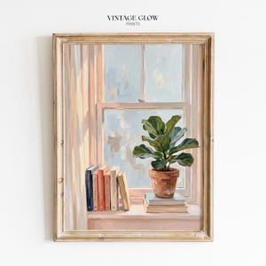 May include: A framed painting depicts a window scene with a potted plant and books. The plant, with large green leaves, sits in a terracotta pot atop a stack of books. Several books are arranged on the windowsill. The window reveals a soft, light-filled sky.