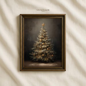 May include: A framed wall art print featuring a dark, moody painting of a Christmas tree decorated with gold ornaments and a star topper. The text VINTAGE GLOW PRINTS is visible at the top center. The frame is dark brown with gold trim.