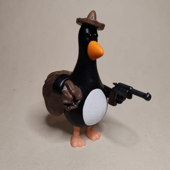 Feathers Mcgraw Figure With a Wallace & Gromit Revolver