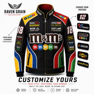 May include: A black motorsport jacket featuring M&M's branding, colorful racing stripes, and various embroidered patches. The front displays the M&M's logo, text, and circular candy graphics. The sleeves show the number 18 and additional racing text.