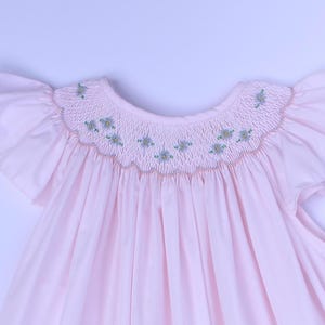Smocked hand embroidered toddler girls dress -Pink sleeveless spring dress with embroidered blue flowers across the neckline.