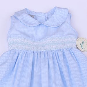Hand‑embroidered dress for girls.  blue and white plaid , sleeveless, embroidered white and blue, flowers and bow at back
