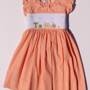 Hand-embroidered dress - Orange and white plaid dress for girls with ruffled sleeves, embroidered sea castle, and a bow at the back.