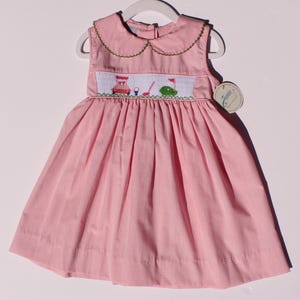 Hand‑embroidered dress for Toddler girl. Smocked dress red and white checkered  with collar and embroidered golf details.
