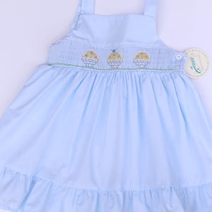 Smocked hand embroidered dress for girls -light blue sleeveless dress with embroidered basket and yellow flowers. Easter dress