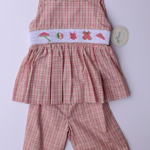 Smocked hand embroidered toddler girls summer outfit. Pink and green pants and blouse with summer embroidery.