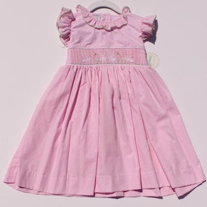 Smocked hand embroidered dress - Pink and white plaid dress for girls with ruffled sleeves, embroidered bunnies, and a bow at the back.