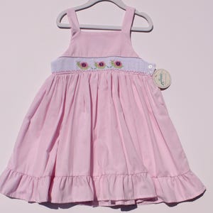 Hand‑embroidered girls dress. Summer dress. Smocked Pink dress with straps, hand-embroidered snails and a little ruffle at the bottom