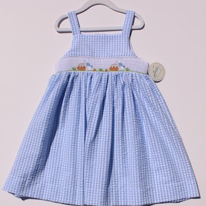 Hand-embroidered summer dress for toddlers. Gathered strap dress with embroidered bunnies and flower baskets.