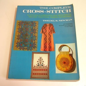 May include: The Complete Cross-Stitch book cover features colorful embroidery designs, including a rug, a dress, and a bag. The book title is in large, bold letters and the author's name is below it.