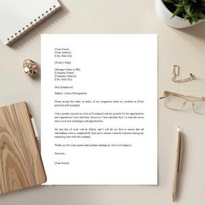 May include: A printed letter on white paper, titled "Letter of Resignation." The letter includes placeholders for the sender's and recipient's information, along with a closing signature line. A pen, glasses, and a notepad are on the table.
