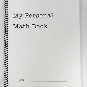 May include: A white spiral-bound notebook with the text "My Personal Math Book" printed in black. Below the title is a line for the owner's name. The notebook is blank inside, ready for math problems and notes.