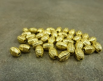 50pc. 7x5mm Criss-Cross Barrel Spacer Beads Antiqued Gold Tone Metal Alloy