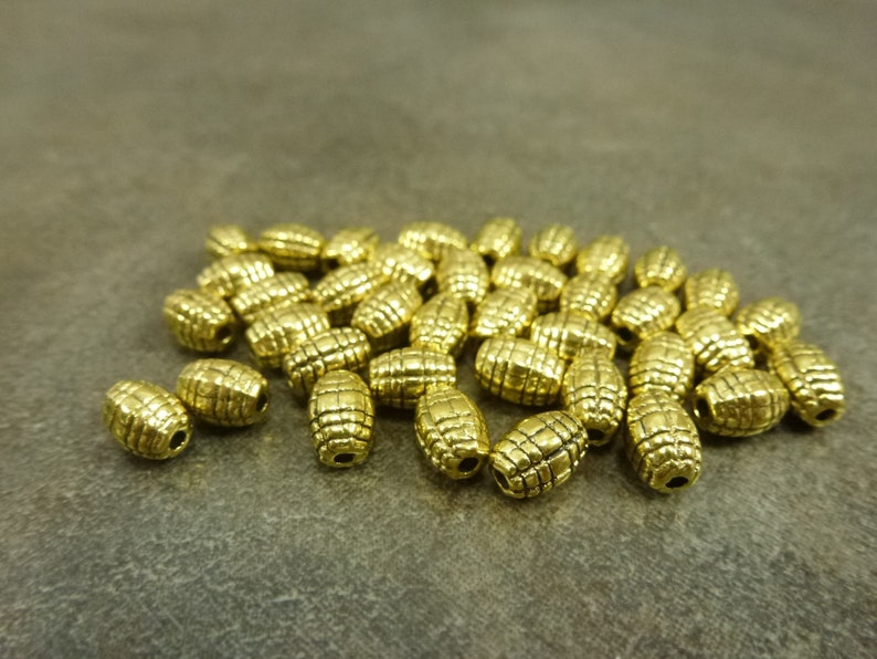 50pc. 7x5mm Criss-Cross Barrel Spacer Beads Antiqued Gold Tone Metal Alloy image 1