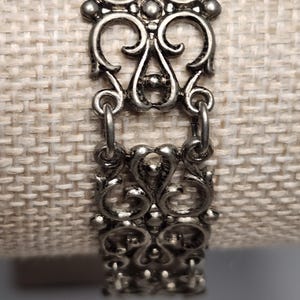 May include: A set of three ceramic mugs with a speckled, matte finish. The mugs are in shades of cream, light gray, and dark gray. Each mug has a simple, minimalist design, perfect for coffee or tea.